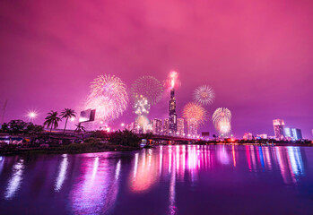 Leinwandbilder Rosa High resolution image of colorful fireworks of Ho Chi Minh City at new year 2021 view from Landmark 81 riverside.  © CravenA