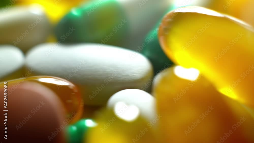 Macroshot of edical pills production. Capsules and pills close up.
