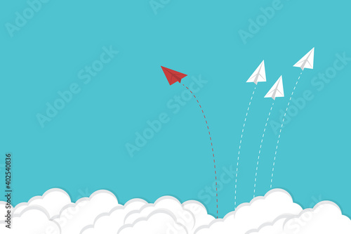Think differently. Red airplane changing direction. New idea, change, trend, courage, creative solution, innovation and unique way concept.