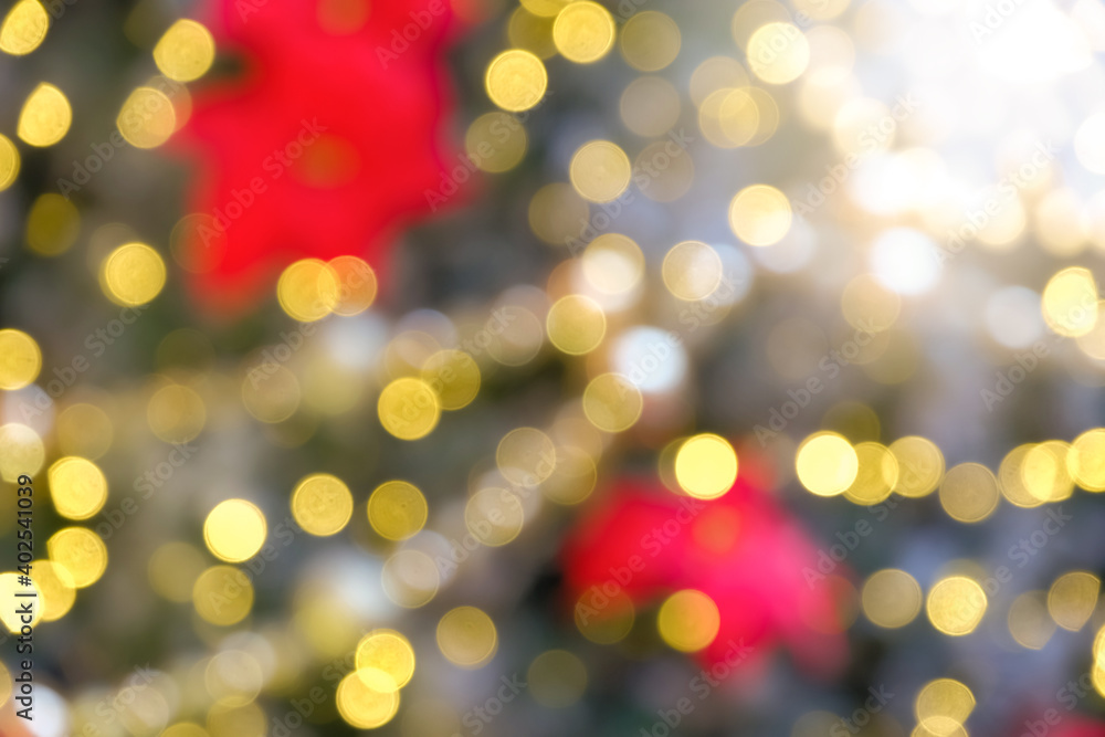 Chrismas light glowing background in the form of bokeh. Shimmering blur spotlights on multicolored abstract wallpaper.