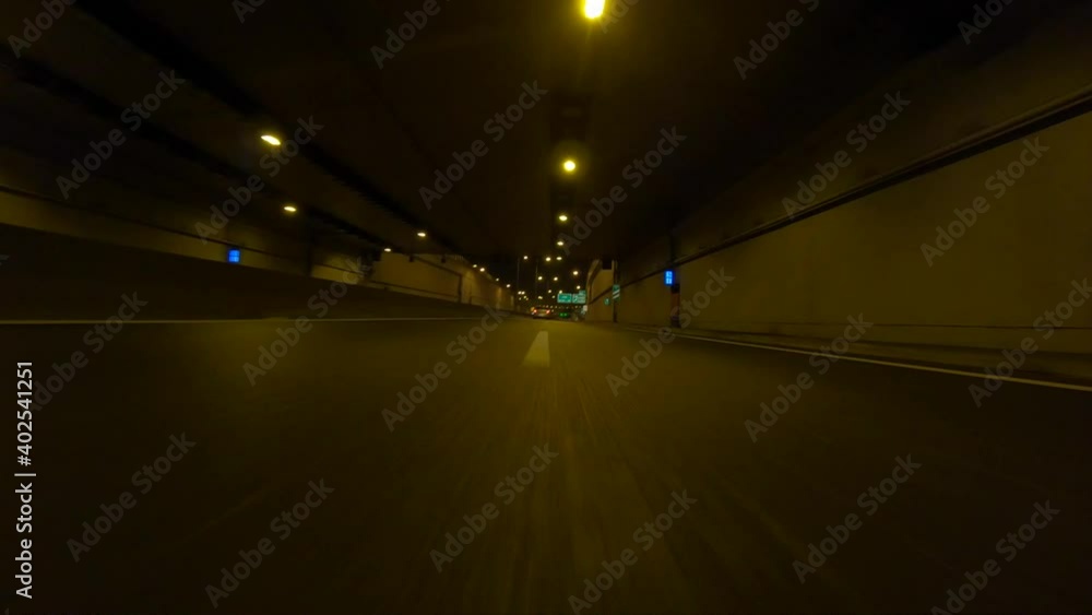 Time-lapse POV fast night video from illuminated highway tunnel Time-lapse POV fast night video from illuminated highway tunnel