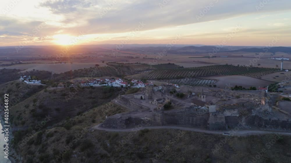 Juromenha castle, village and Guadiana river drone aerial view at sunset in Alentejo, Portugal Juromenha castle, village and Guadiana river drone aerial view at sunset in Alentejo, Portugal