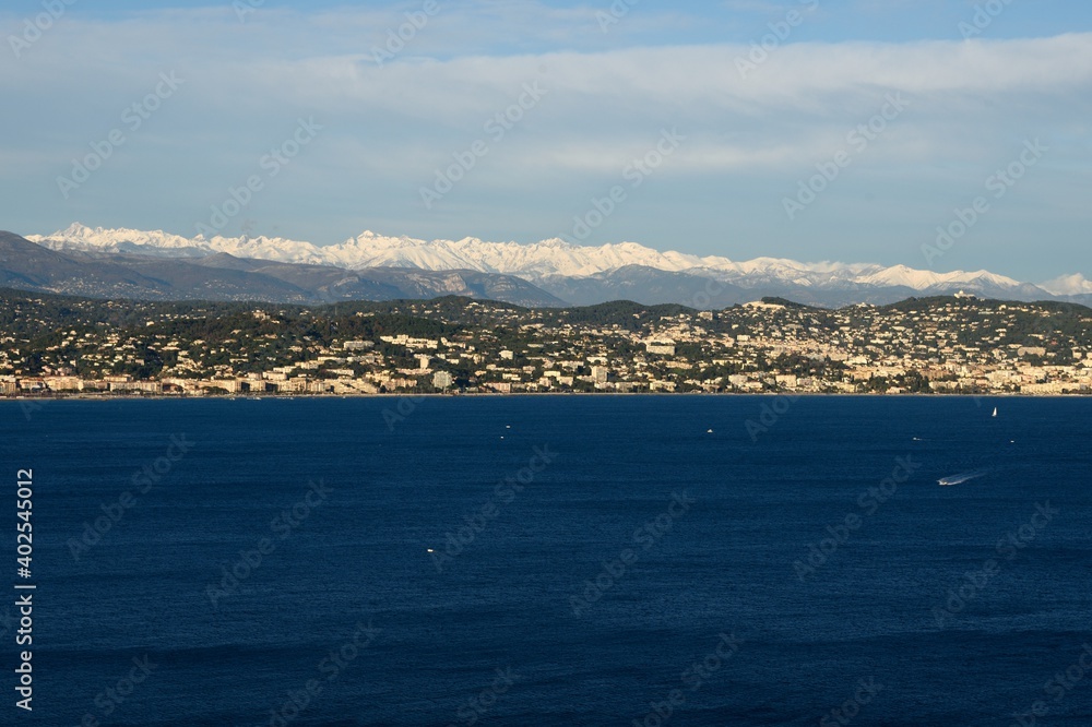 Snow on the mountains and the Mediterranean sea.