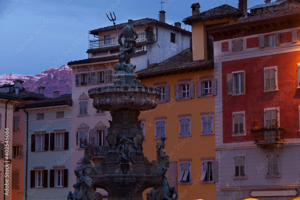 Piazza del Duomo and Neptune fountain, Trento, Italy with Alps in the background