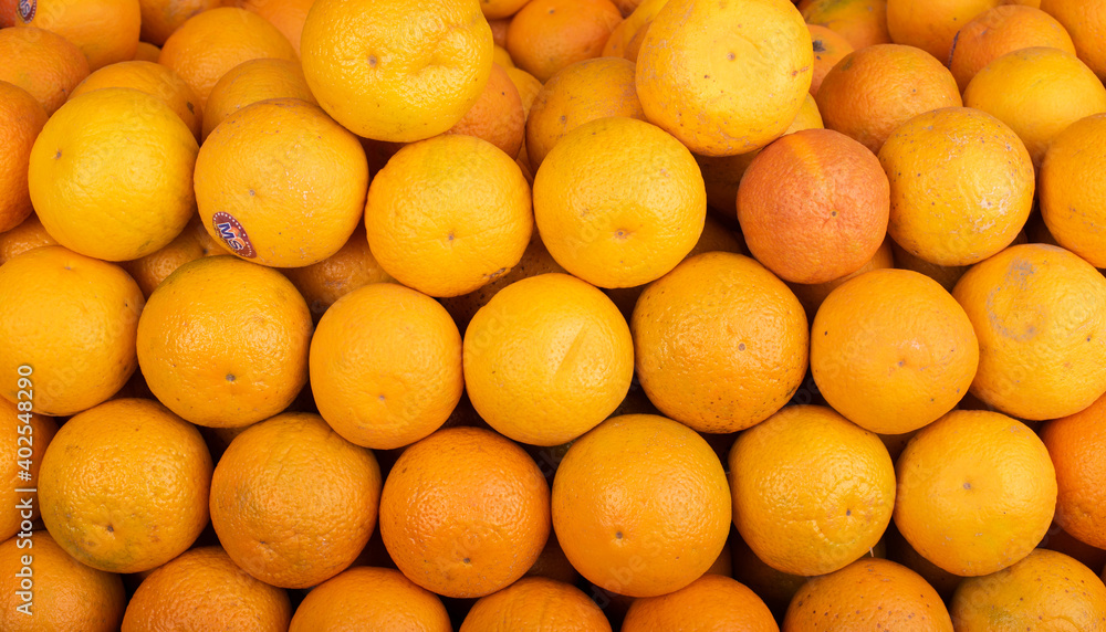 A closeup of large amount of fresh oranges A closeup of large amount of fresh oranges