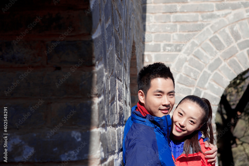 Young couples take pictures in the Great Wall Tourism