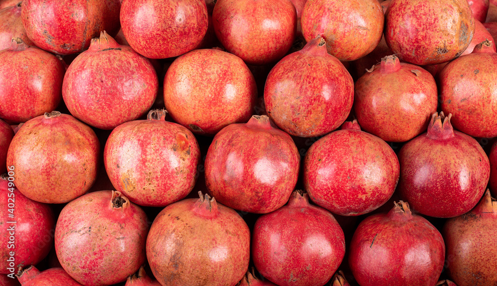 Fresh red pomegranate placed in pattern order. Fresh red pomegranate placed in pattern order.