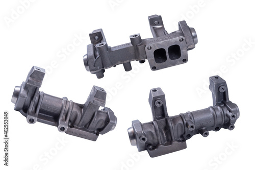 new exhaust manifold of the KAMAZ car, on a white background. The front part of the exhaust system of the internal combustion engine exhaust gas.