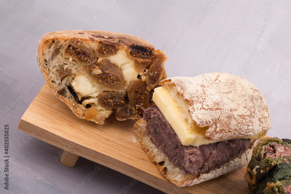 Korean sweet red bean with Butter bread and Fig bread on a wooden board. Korean sweet red bean with Butter bread and Fig bread on a wooden board.