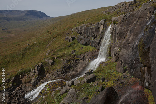 Beautiful cascade waterfall Bleiksarfoss in Eskifjordur, east of Iceland
