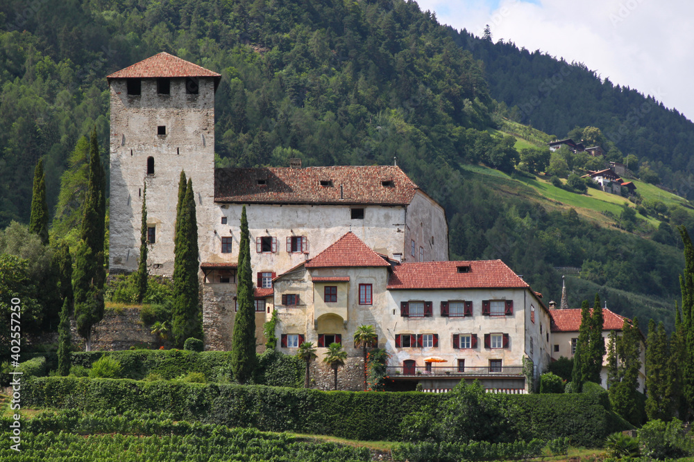 Old medieval Lebenberg Castle on a mountain slope in the village of Tscherms near Merano, South Tyrol in Italy
