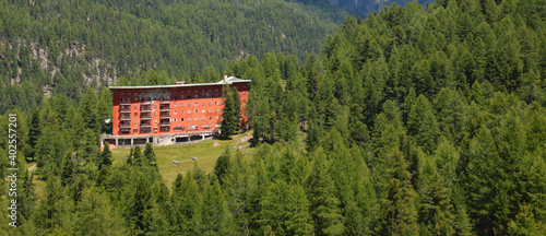 Ruins of the Hotel Paradiso del Cevedale in the Martell valley forest in South Tyrol, an example of italian fascist architecture photo
