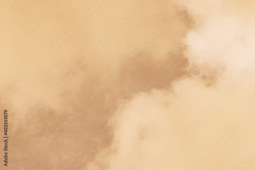 Soft and warm cloudy day in close up sky background. Natural border in golden light color of sky and clouds.