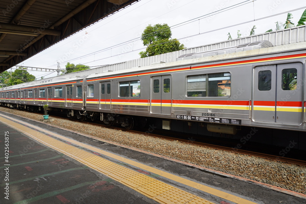 Commuter Line (train) arrives at a station railway station, Jakarta. Commuter Line (train) arrives at a station railway station, Jakarta.