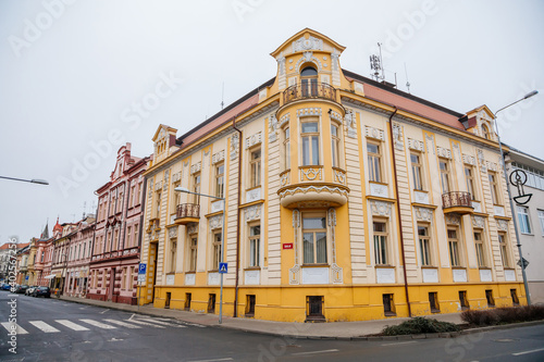 Yellow neo-renaissance house at Wenceslas square in winter day  Narrow picturesque street with historical buildings  Lovosice  Czech Republic