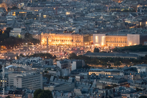 Aerial view of Place de la Concorde in Paris at dusk with the city illuminated