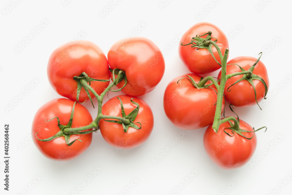 Tomatoes on a white background, tomatoes with a sprig Tomatoes on a white background, tomatoes with a sprig