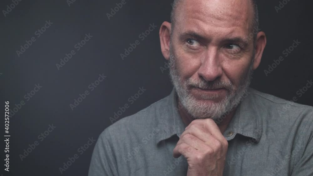 portrait of a modern authentic mature businessman on black background portrait of a modern authentic mature businessman on black background
