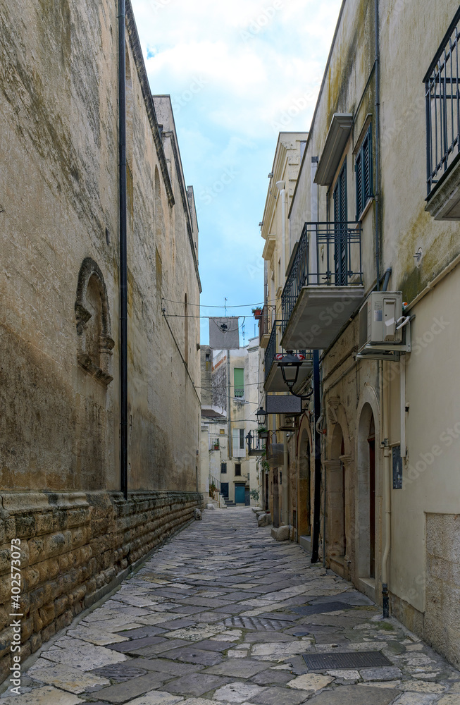 narrow old street at the historic part of Altamura, Italy