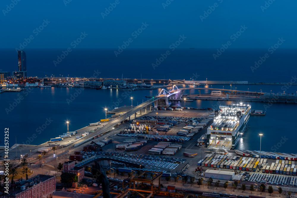 Fototapeta premium night urban landscape of the port of the city of Barcelona.