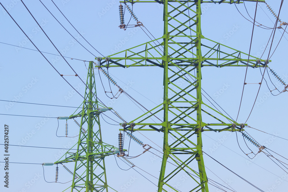 Electricity pole against blue sky clouds, Transmission line of electricity to rural, High voltage electricity pole on bright sky clouds background, electricity transmission pylon Electricity pole against blue sky clouds, Transmission line of electricity to rural, High voltage electricity pole on bright sky clouds background, electricity transmission pylon