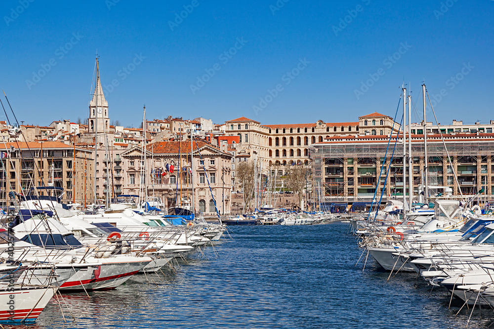harbor with sailing boats in Marseilles with view to the promenade of the old town