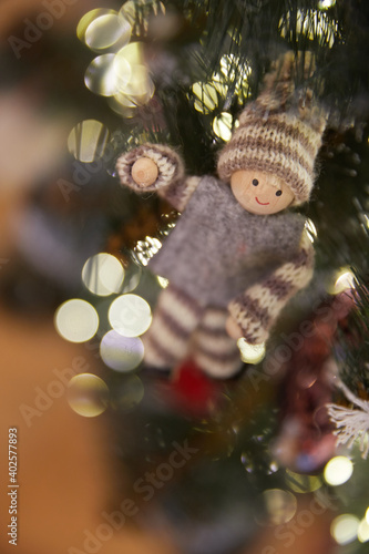 Christmas tree toy on Christmas tree branches and bokeh