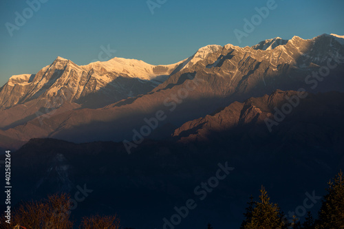 Himalayan mountain peak Annapurna Range during sunrise.
