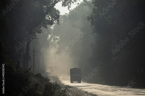 Canvas Print Semi-truck driving on dirt road in Nepal.