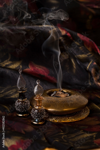 Agarwood, also called aloeswood, essential oil and burning incense chips