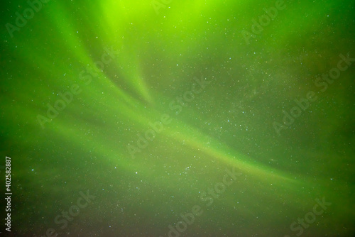 Beautiful northern lights aurora borealis against the background of the starry sky
