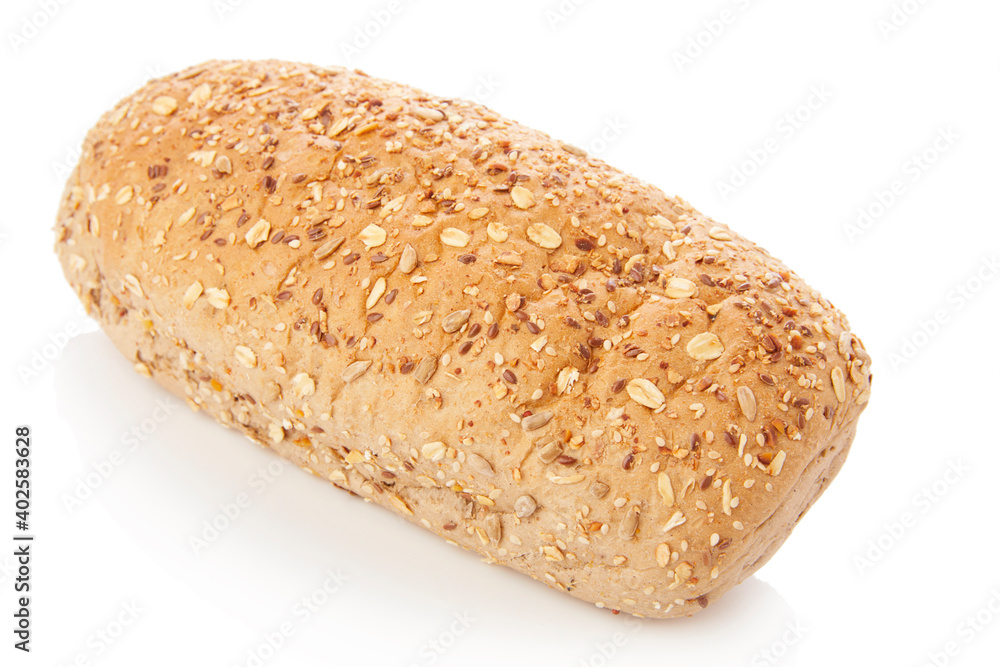 long loaf of multigrain whole wheat bread on white background. long loaf of multigrain whole wheat bread on white background.