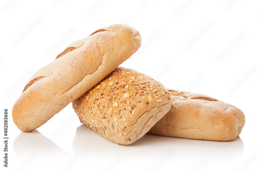 long loaf of multigrain whole wheat bread on white background.
