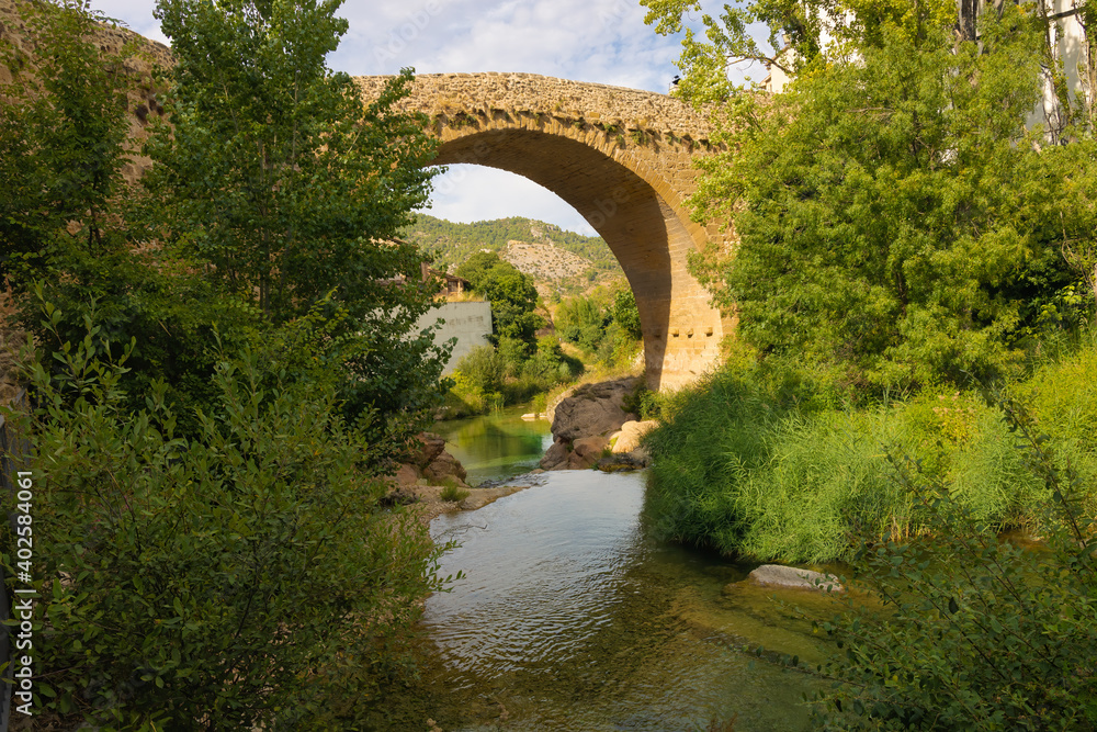 View of the medieval bridge of the Matarranya river from Beceite, Aragon, Spain