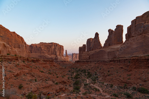 landscape hiking trail surrounded by red rocks in the desert