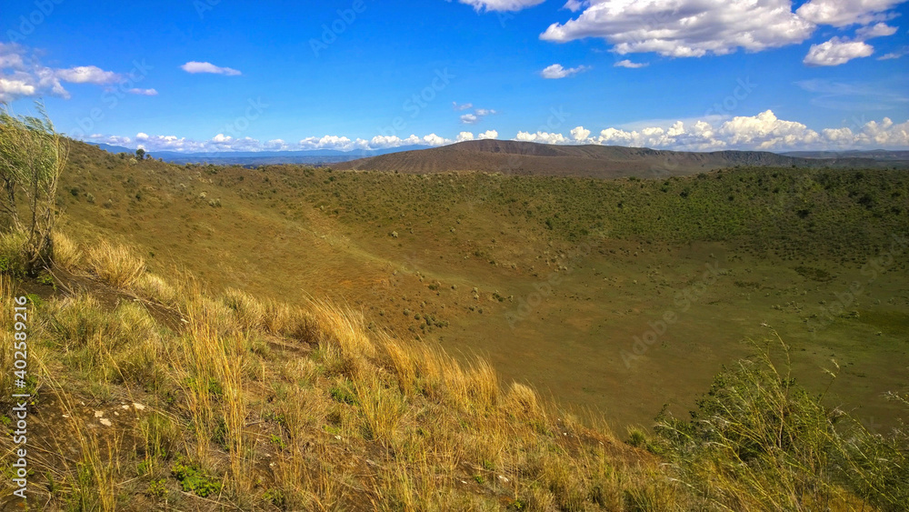 Scenic volcanic crater against sky in Naivasha, Kenya Scenic volcanic crater against sky in Naivasha, Kenya
