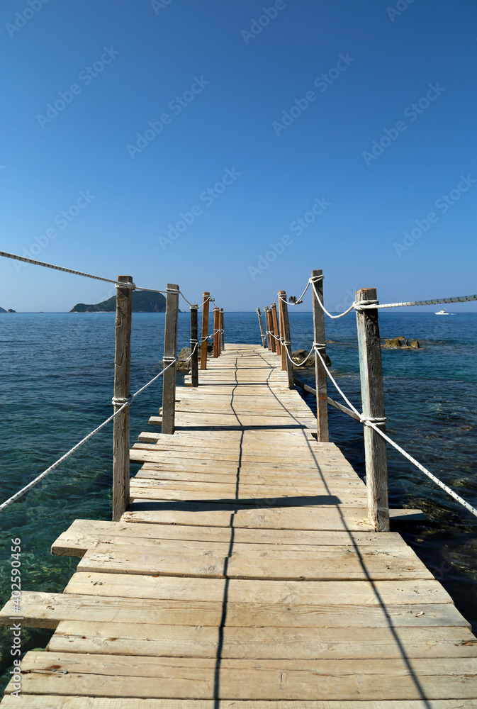 Naklejka premium Landscape with wooden bridge in the sea