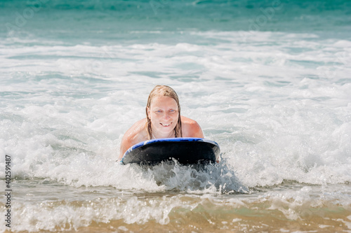 Woman surfing in waves of Atlantic Ocean © amelie