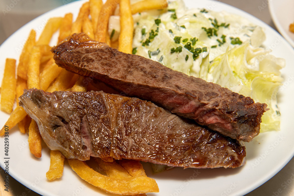 A plate of delicious stake and chips on a white plate A plate of delicious stake and chips on a white plate