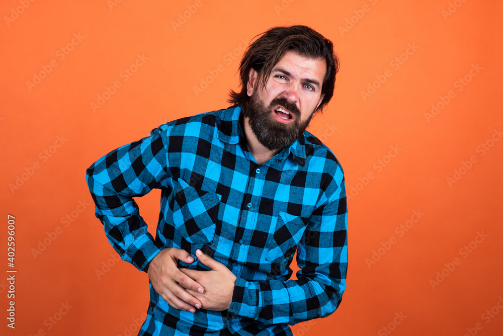 brutal man in checkered shirt has long beard feel pain, medicine brutal man in checkered shirt has long beard feel pain, medicine