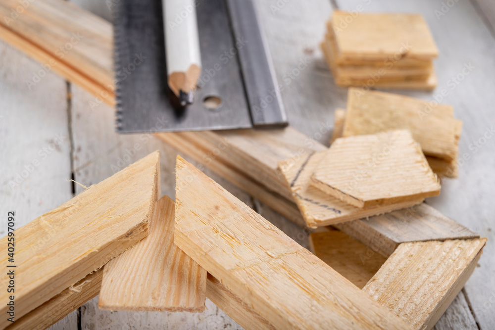 Angular connection of two pieces of wood. Making a wooden frame for a painting. Workplace carpentry workshop. Angular connection of two pieces of wood. Making a wooden frame for a painting. Workplace carpentry workshop.