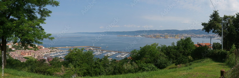 San Rocco : panorama of the modern marina with luxurious boats and modern buildings surmounted by manicured green lawns