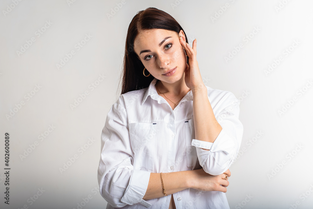 close up portrait, young, nice, attractive, lovely pretty cheerful girl with folded arms isolated over light white background of pastel colors close up portrait, young, nice, attractive, lovely pretty cheerful girl with folded arms isolated over light white background of pastel colors