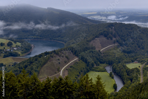 landscape of the belgian ardennes of water management a reservoir a river and roads the hilly idyllic village of coo Belgium