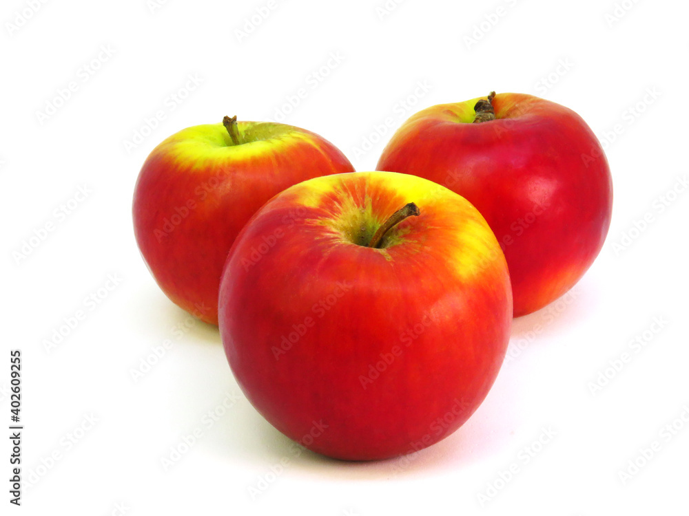 Three freshness red-yellow apples on white background.    