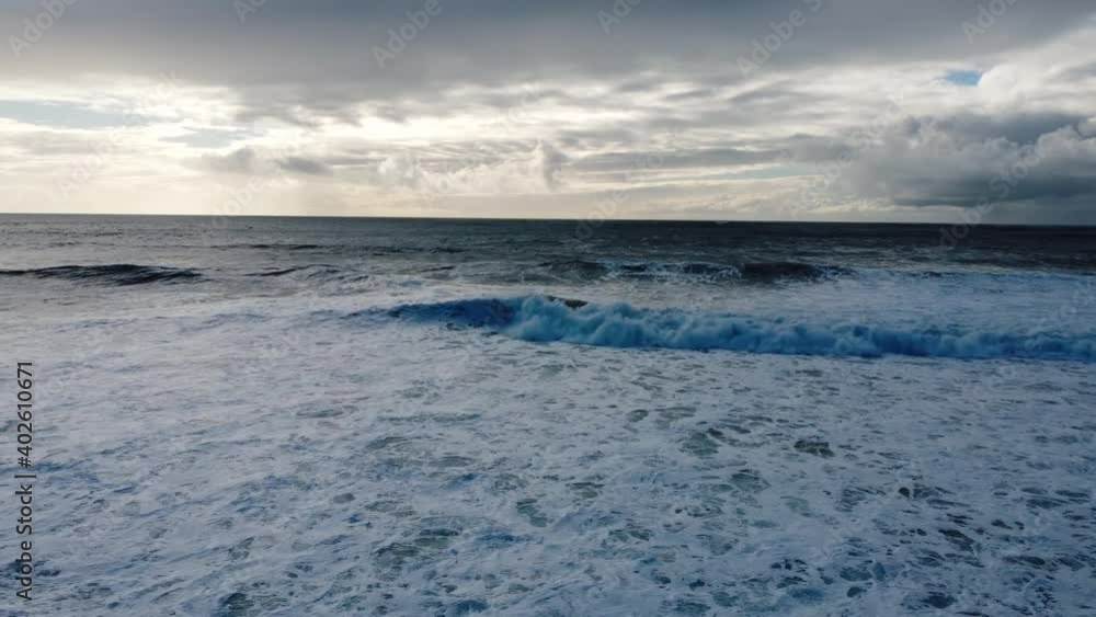 An aerial view of waves in a beach in Costa da Caparica, 15 minutes from Lisbon, Portugal An aerial view of waves in a beach in Costa da Caparica, 15 minutes from Lisbon, Portugal