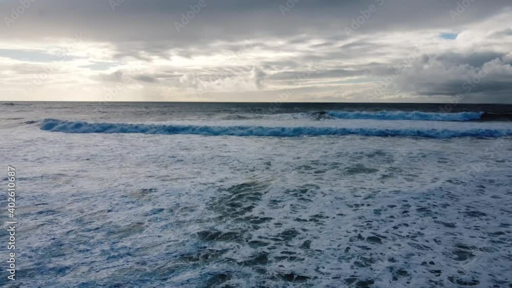 An aerial view of waves in a beach in Costa da Caparica, 15 minutes from Lisbon, Portugal An aerial view of waves in a beach in Costa da Caparica, 15 minutes from Lisbon, Portugal