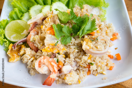 Shrimp fried rice on a wooden table from a top view