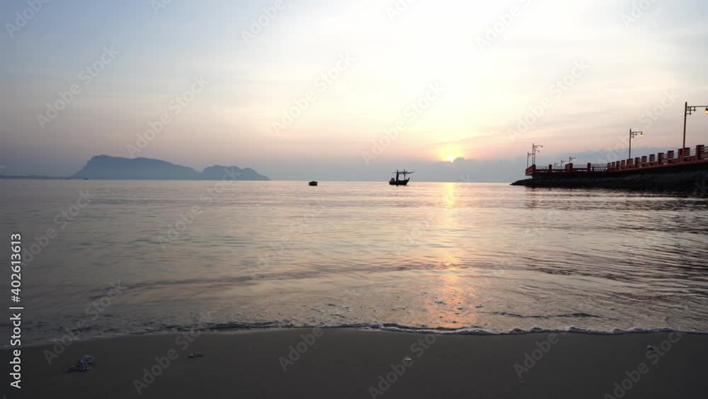Sunrise is reflection on beach at ocean in Tropicana Sunrise is reflection on beach at ocean in Tropicana