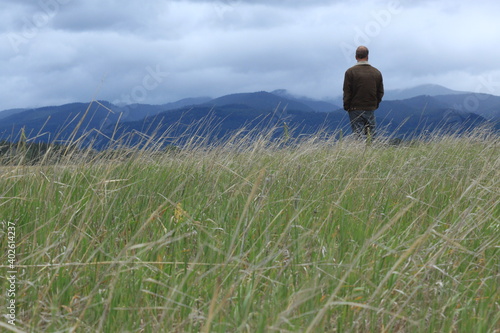Man pondering in Montana landscape